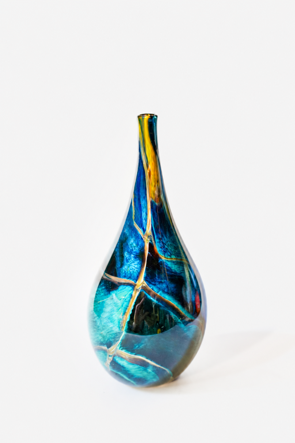Hand-blown one-of-one glass vessel with blue and amber inclusions